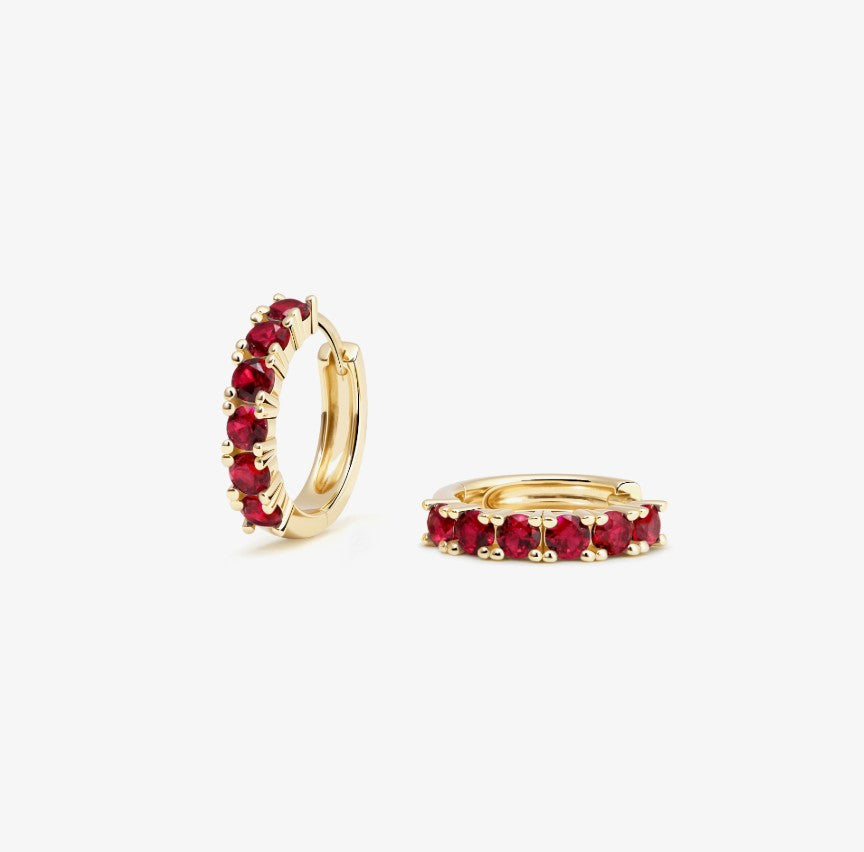 Gold hoop earrings with embedded rubies