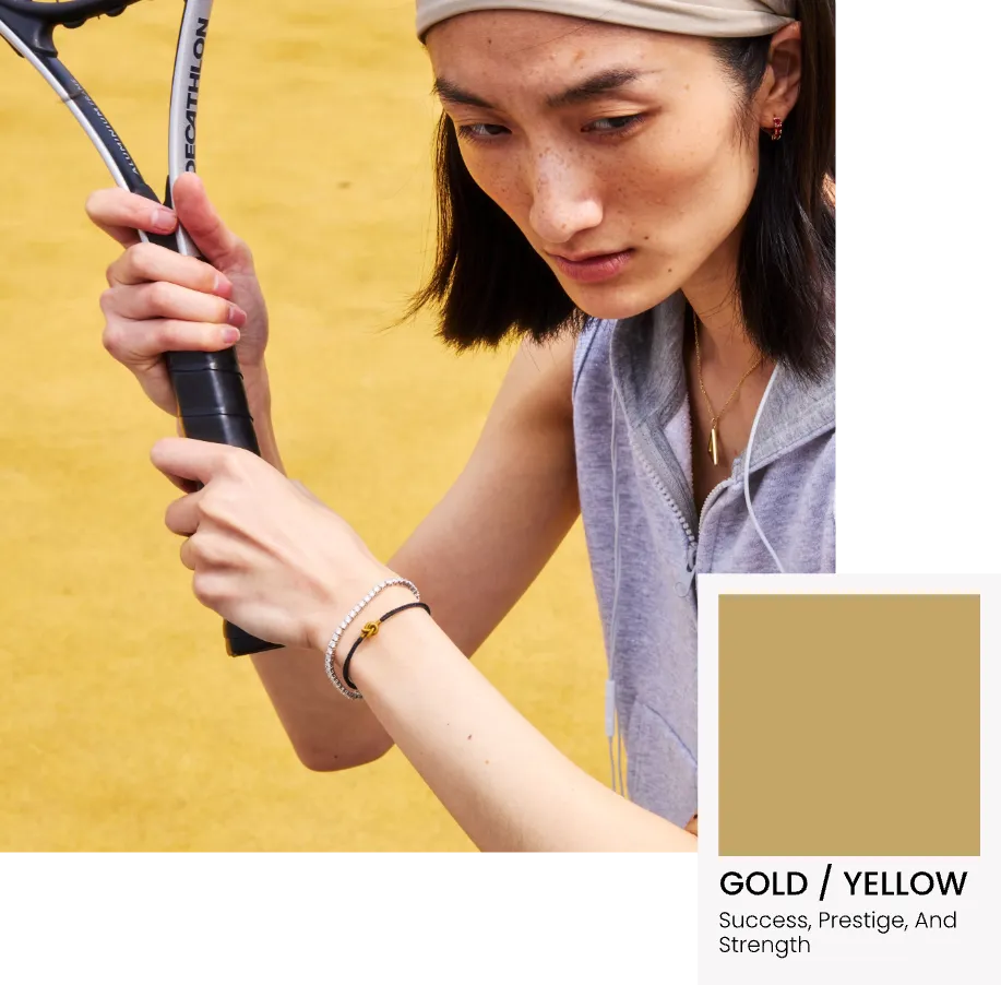 Person holding a tennis racket with a color swatch labeled 'Gold/Yellow' on a yellow background