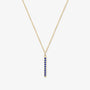 Gold bar necklace with blue sapphires