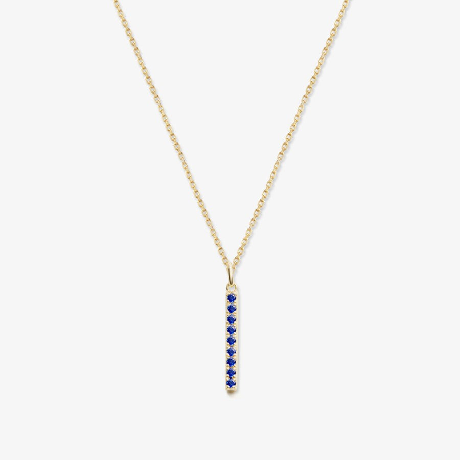Gold bar necklace with blue sapphires