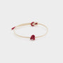 white string bracelet with a red union knot
