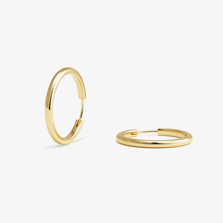 A pair of large gold hoop earrings