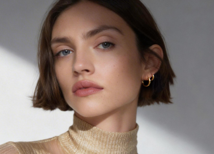 woman wearing gold hoops