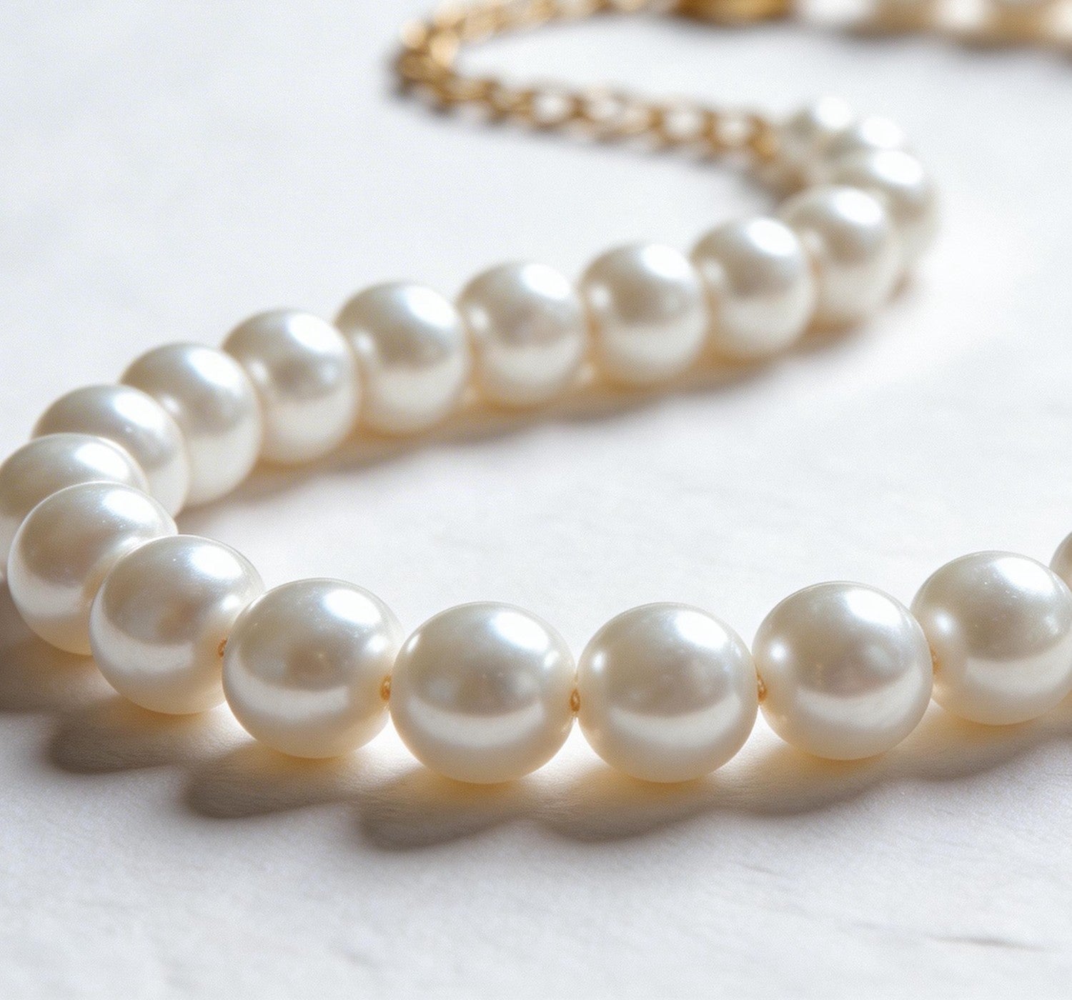 Pearl necklace on a light background